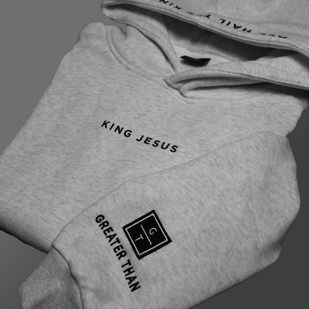 King Jesus hoodie with embroidered design on the wrist of the GREATER THAN Christian Ministries logo