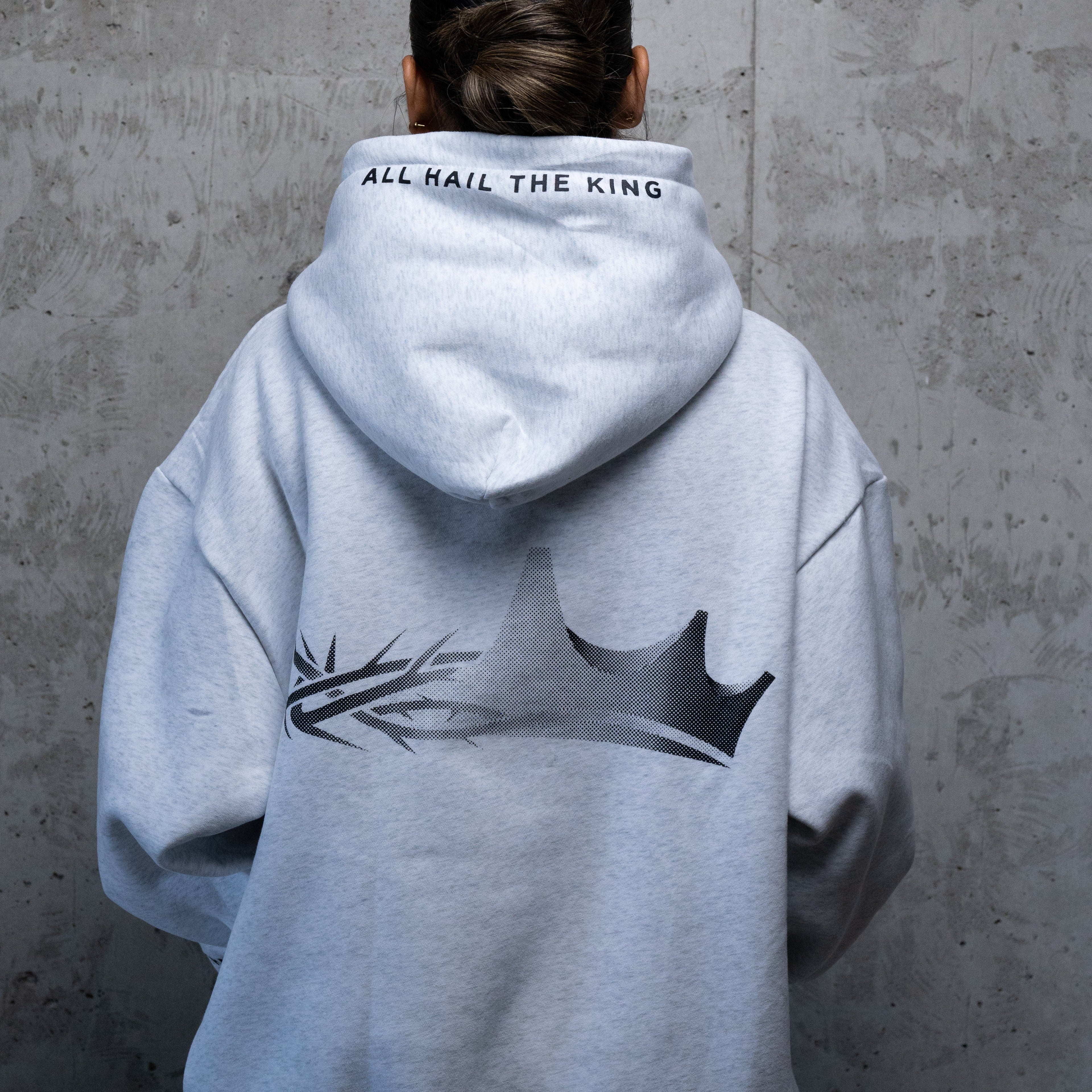 a Christian hoodie featuring a design that is half crown of thorns and half a regular crown.